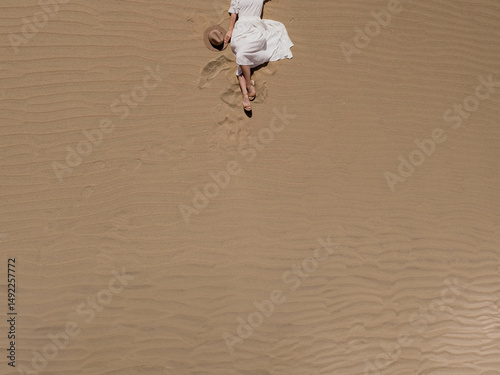 Aerial View of Woman Relaxing in Desert Sand