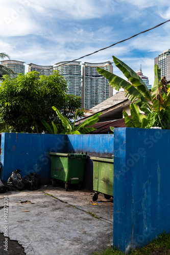 Overflowing garbage corner by banana trees, Kuala Lumpur, Malaysia