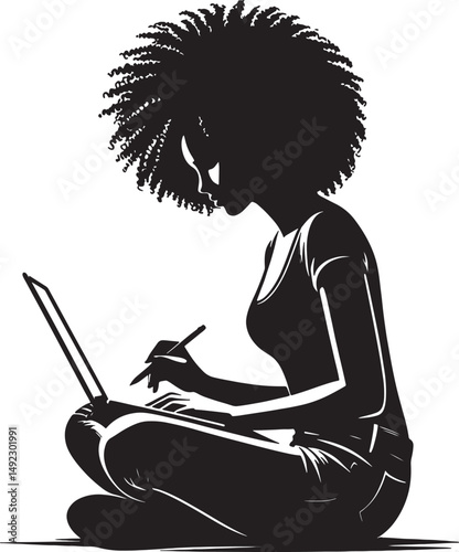 Silhouette of a woman with afro working on a laptop while sitting cross legged
