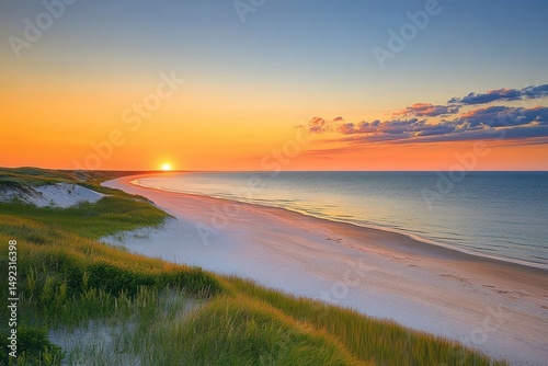 Peaceful sunset over a serene sandy beach with gentle waves and grassy dunes under a colorful sky