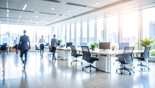 A softly blurred office interior with neutral tones and open-plan desks creates a clean, modern corporate atmosphere. Natural light streams through large windows.