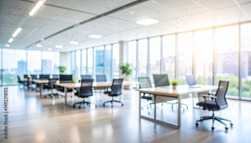 A softly blurred office interior with neutral tones and open-plan desks creates a clean, modern corporate atmosphere. Natural light streams through large windows.
