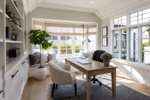 Inviting home office with a desk, comfortable chair, and calming neutral color scheme.