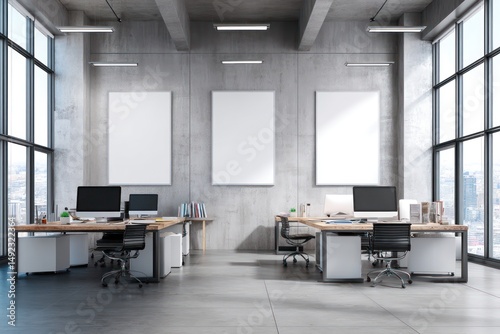 Clean office with raw concrete finishes, whiteboard frames, and sleek desk setup.