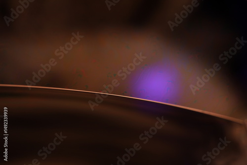 Brown liquid surface, brown Reflections of liquid in macro,, bubbles in macro, connection of bubbles in macro, cell from liquid, dark background, glossy surface 