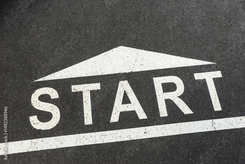 Start Line. Start, word on black asphalt
