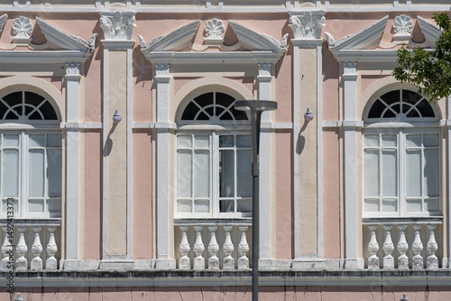 Ornate historic building facade with pastel colors.