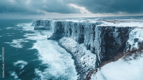 snow-covered cliffs with a dramatic ocean backdrop under a stormy winter sky, Generative AI