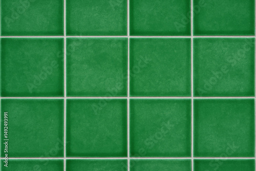 Green Tile Grid: A close-up, symmetrical view of a grid of vibrant, green tiles, arranged in neat rows and columns with bright white grout, creating a sense of order and cleanliness.