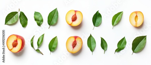 Sliced Peach Halves and Green Leaves Arranged Neatly on White Background, Flat Lay, Healthy Eating Concept, Summer Fruit