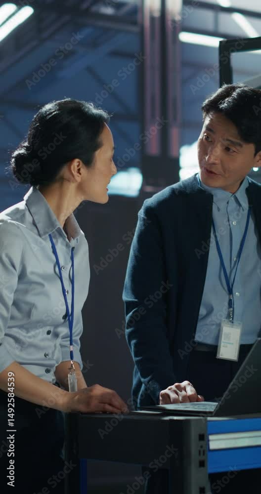 Vertical Screen: Asian Network Engineer and Data Analyst Collaborate on ...