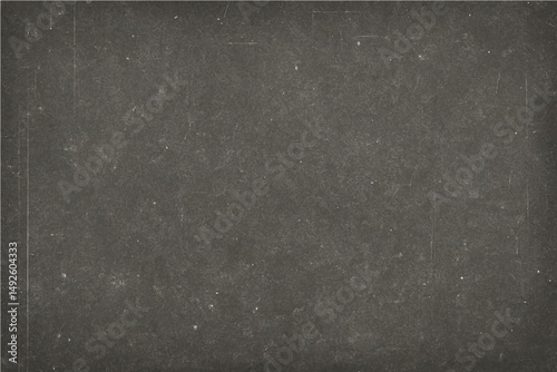 A dark gray grunge metal design on an old, rough concrete wall creates a textured backdrop
