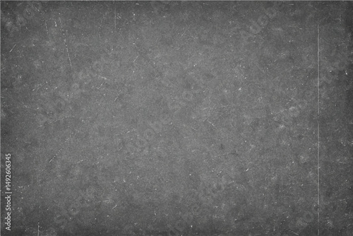 A dark gray grunge metal design on an old, rough concrete wall creates a textured backdrop