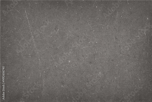 A dark gray grunge metal design on an old, rough concrete wall creates a textured backdrop