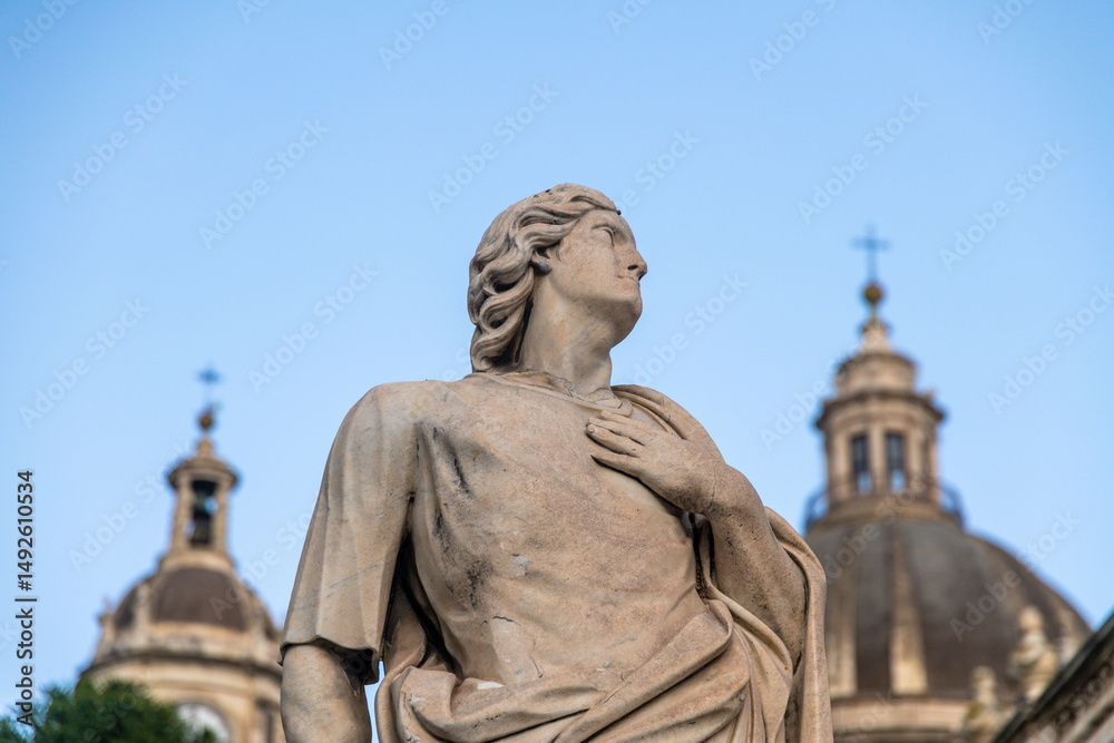 Fototapeta premium Statue in Front of SantAgata Cathedral Domes Catania