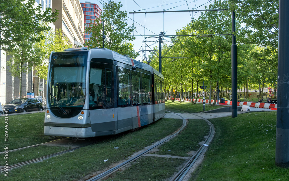 Tram in Rotterdam city, public transportation, sunny day in Netherlands Holland