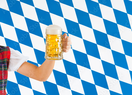 Woman holding beer stein celebrating Oktoberfest in Bavaria