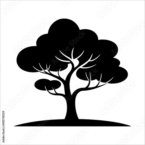 Silhouette of a tree with broad rounded canopy and thick trunk isolated on white background.