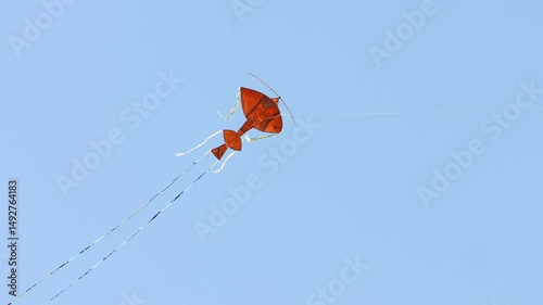 Paper kite flying in the blue sky