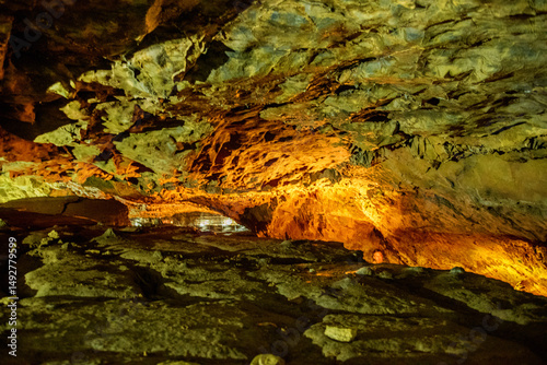 A close-up view of a limestone cave, filled with colorful,curious,wonderful. Lighting enhance texture and geological beauty.