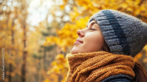A person wearing a warm scarf, taking a deep breath of crisp autumn air in a forest