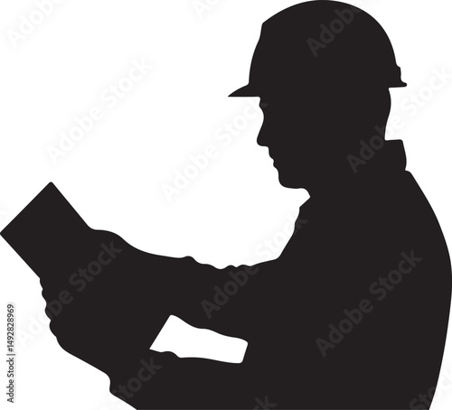 Silhouette of Construction Worker Reviewing Plans