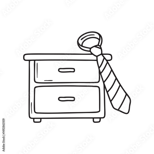 A tie tangled beside a drawer full of accessories