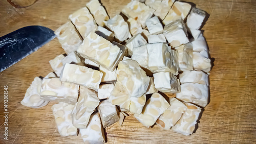tempeh pieces for cooking on a wooden base