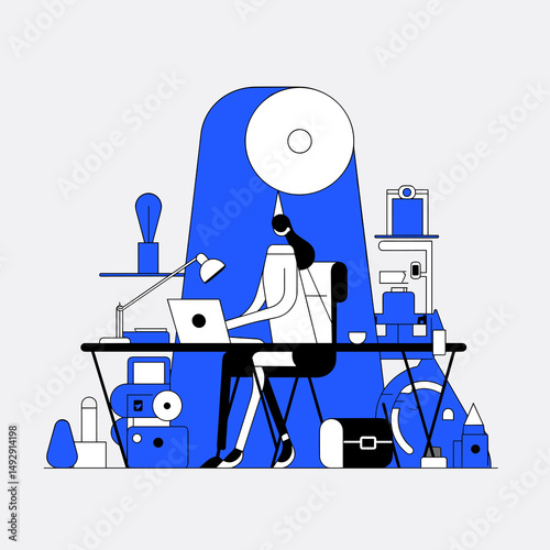 The Creative Space: A person focused intently on her laptop amidst an array of creative tools and resources, a testament to innovative pursuits.