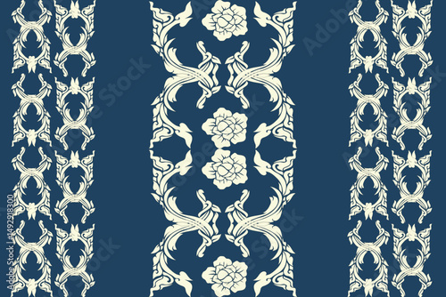 Elegant traditional Thai pattern featuring pink and cream kanok flame motifs and floral elements arranged in horizontal borders on a deep blue background. This seamless vector design is perfect 