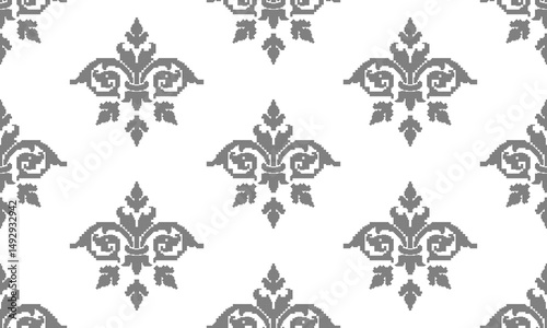 a fabric pattern composed of pixelated with gray flower and white background designs