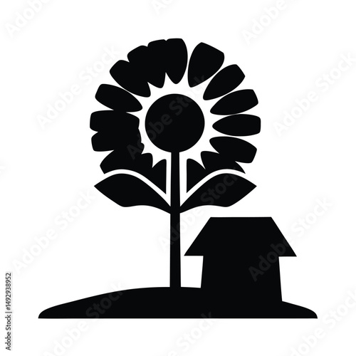 Stylized black and white sunflower growing next to a small house building