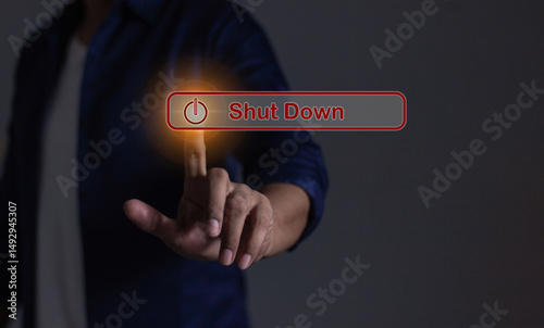 Young man hand touching Shut Down button press power OFF
