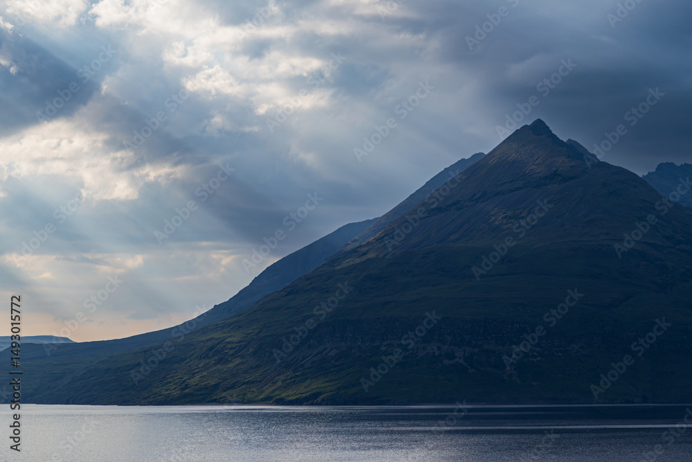 Fototapeta premium Blue Hour Sunbeams Over Highland Peaks