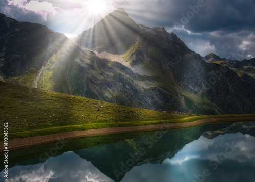 View on a lake and mountains above Defereggental valley on a summer day