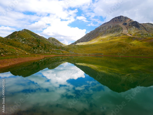 View on a lake and mountains above Defereggental valley on a summer day