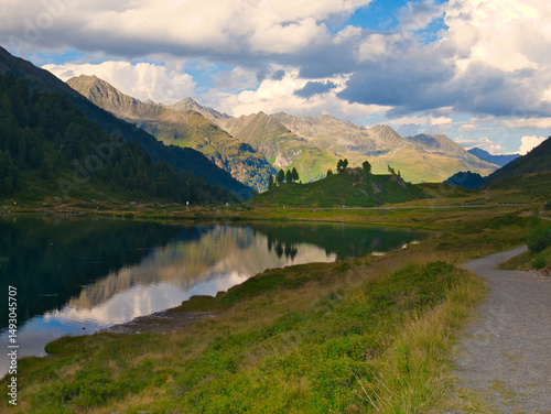View on Obersee lake and mountains above Defereggental valley on a summer day