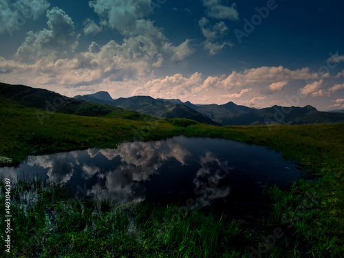Mountain lake near Saalbach Hinterglemm Leogang ski resort during summer day