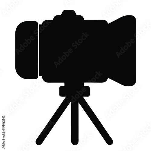 Silhouette of a professional camera on a tripod ready for filming