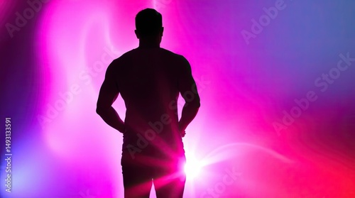 Silhouette of muscular man against vibrant colorful background art