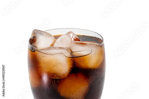 Close-up of cola with ice cubes on white background. Detailed close-up of a glass of cola with ice cubes. The interaction of light, glass and bubbles creates a refreshing visual effect.