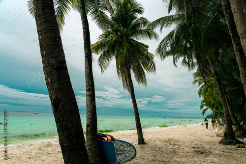 Fototapeta Naklejka Na Ścianę i Meble -  sea, sun and sand. White sand beach with blue water, white sand and palm trees. Summer vacation vibes. Beaches in asia.