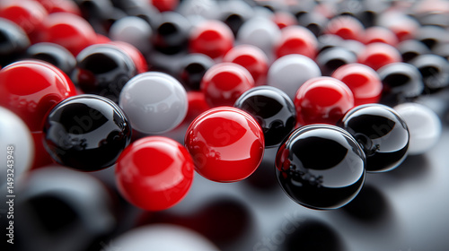 Abstract design of clustered glossy spheres in red, black, and white