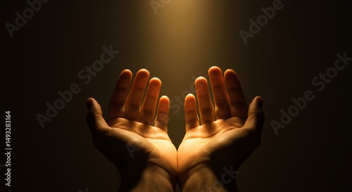 praying hands in light