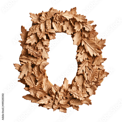 Decorative autumn leaf wreath made of brown maple and oak leaves arranged in circular shape for seasonal decor