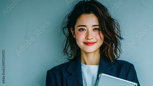 Confident Young Asian Businesswoman Holding Tablet Against Gradient Background – Professional Corporate Portrait for Technology, Business, and Modern Marketing Use