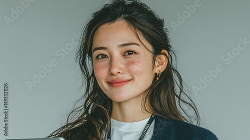 Confident Young Asian Businesswoman Holding Tablet Against Gradient Background – Professional Corporate Portrait for Technology, Business, and Modern Marketing Use