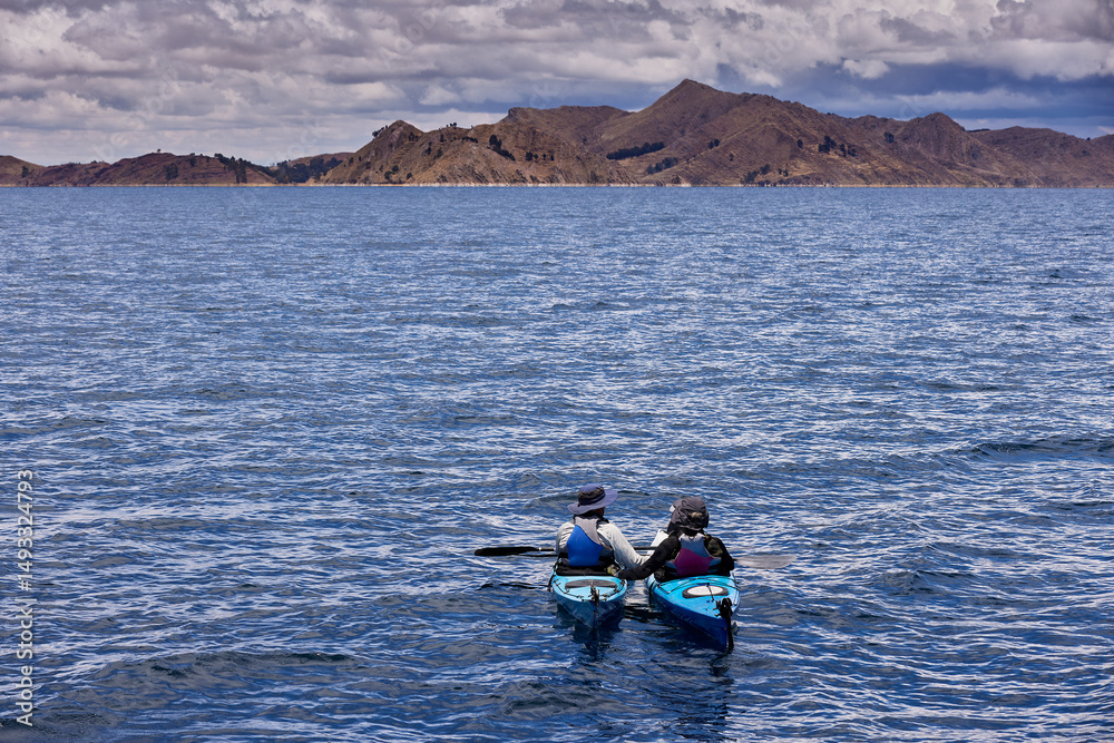 Obraz premium Sea kayaking on Lake Titicaca can be a unique and memorable experience, allowing you to explore its stunning landscapes, traditional communities.