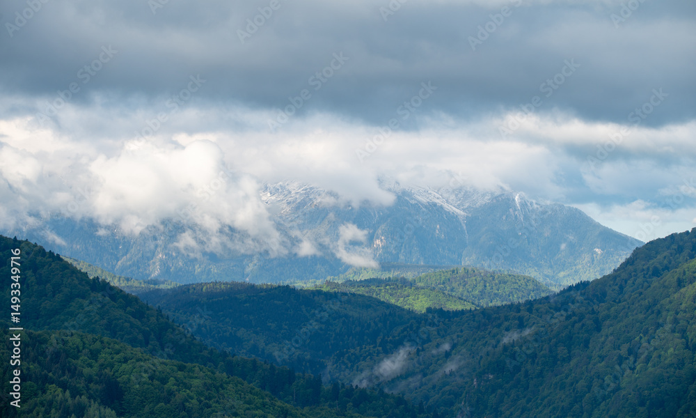 Naklejka premium mountain landscape with clouds
