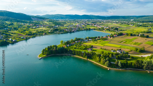 Scenic aerial view of lake (Jezero) Sabljaci near Ogulin, Croatia – a peaceful reservoir surrounded by forests and hills, perfect for outdoor activities and nature lovers photo